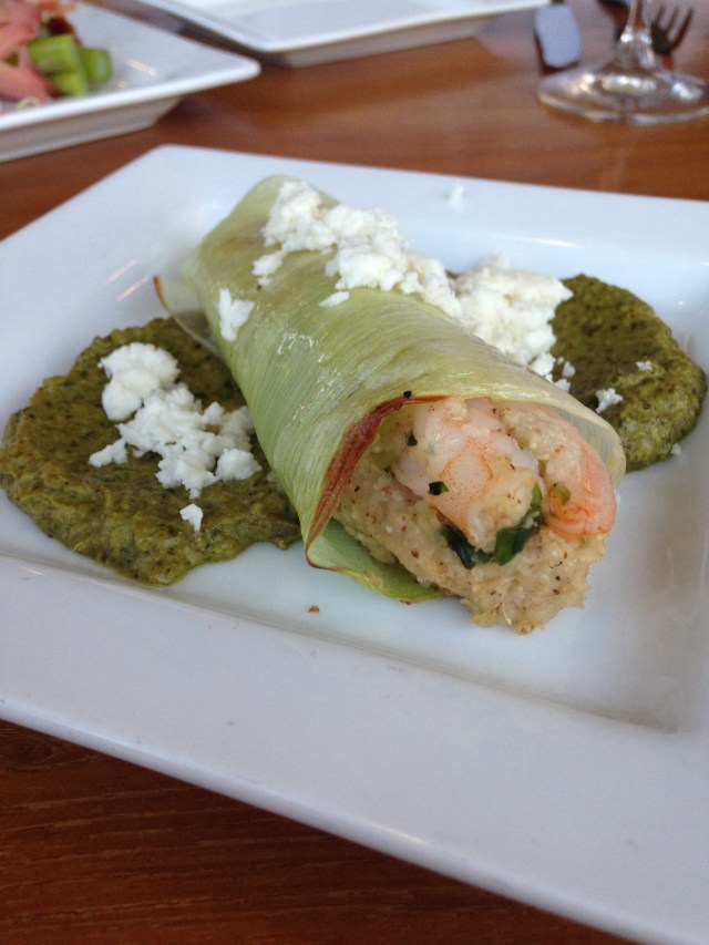 Shrimp and grits in a leek "tamale" with roasted salsa verde and feta cheese